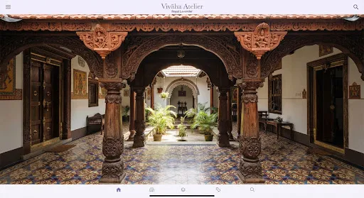 Details of Chettinad carved teakwood archways and Athangudi tiles